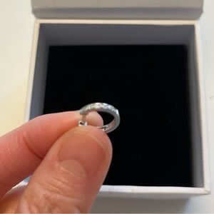 Half pave white gold huggie